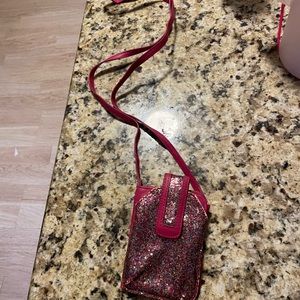 Gently used pink sparkly candies crossbody Waller and phone holder